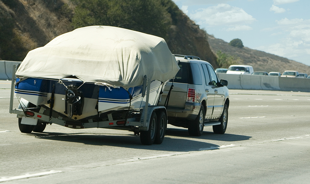 When I’m towing my boat or travel trailer, is it legal for me to be in the left lane on the freeway?