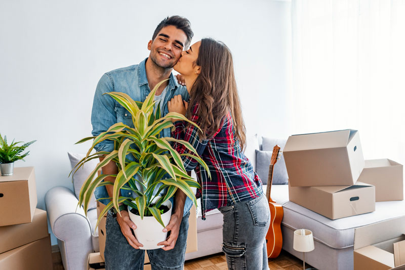 Young couple moving into apartment.